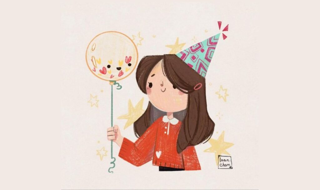 birthday girl holding a balloon
